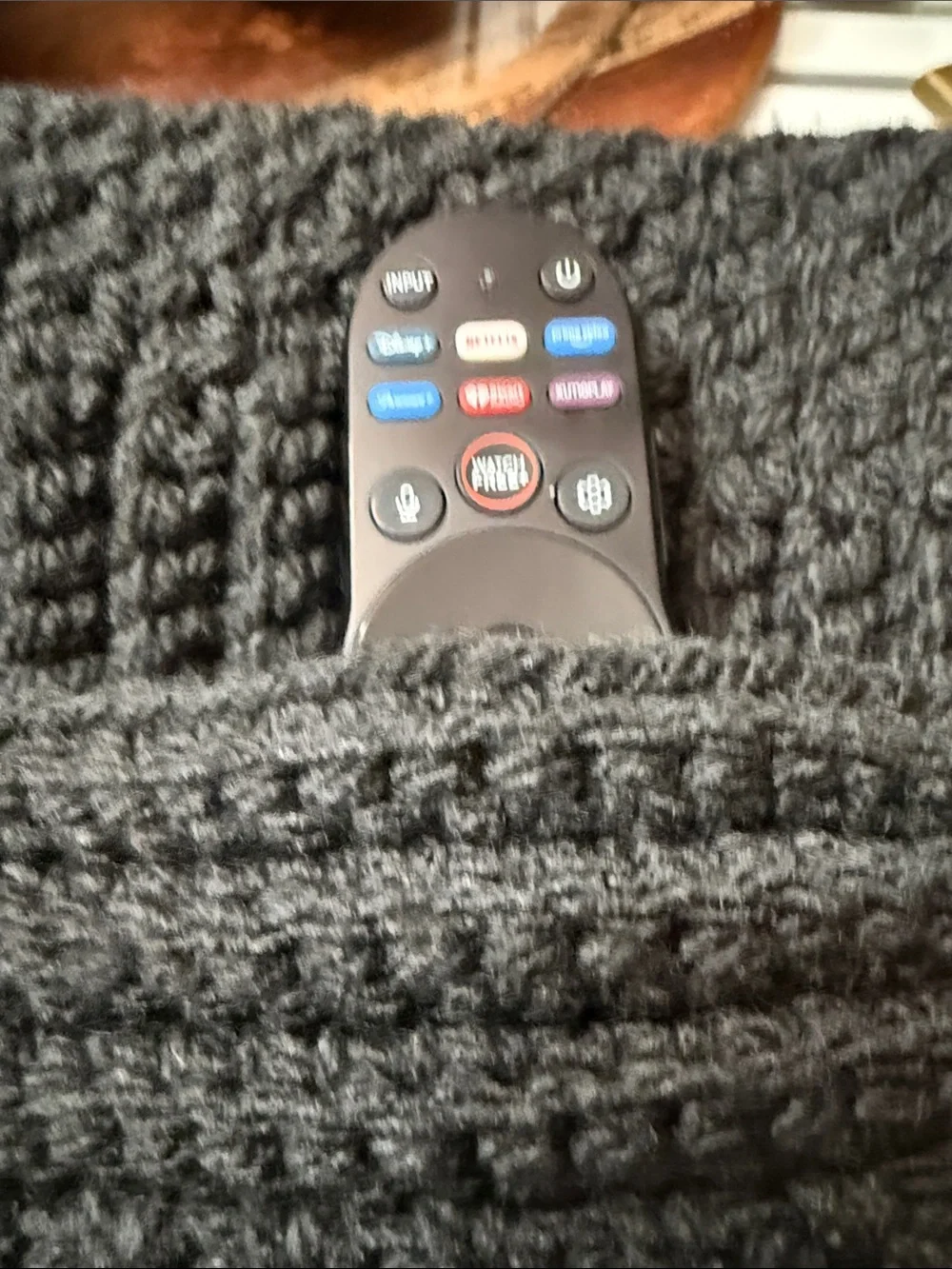 Artisan Black Ribbed Knit Throw Blanketwith pockets for storing things on couch